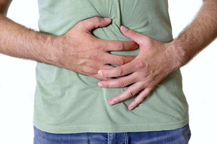 Pain and bloating - symptoms of the presence of worms in the intestines